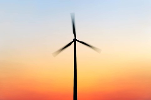 Wind turbine at sunset
