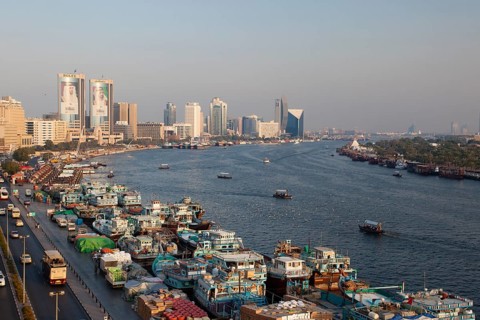 Dubai Creek with old dhows laden with cargo