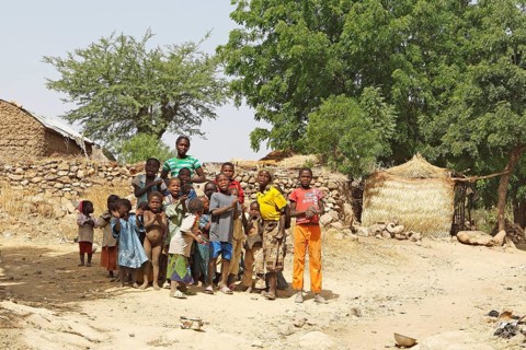 Group of children singing a song of welcome