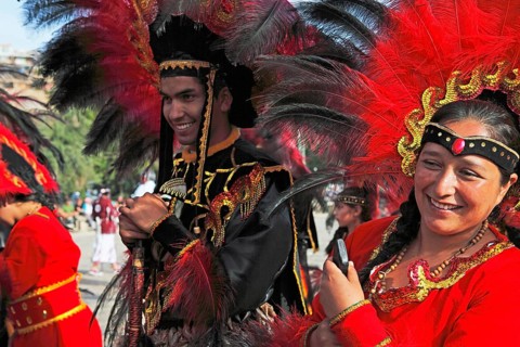 Man and woman wearing festive traditional Indio costumes