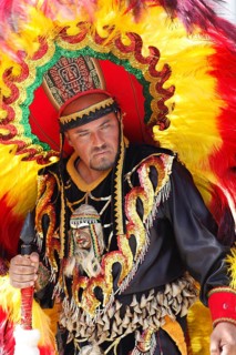 Man wearing a festive traditional Indio costume
