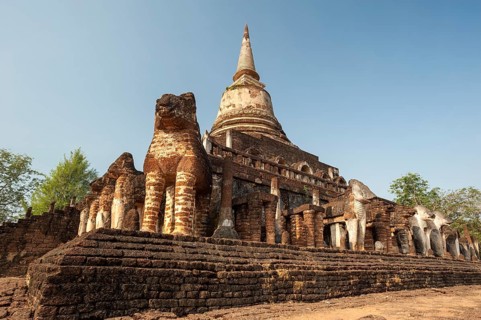 Laterite chedi with destroyed elephant statues