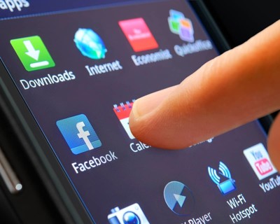 Icon of a smartphone app being selected by a finger