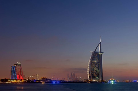 The luxury hotel Burj Al Arab off Jumeirah beach at dusk