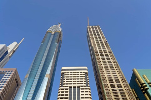 Skyscrapers on Sheikh Zayed Road against a blue sky