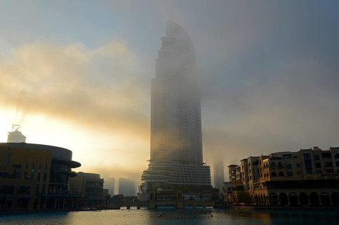 Dubai Mall in the morning mist on Lake Burj Khalifa