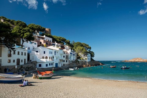 Houses and fishing boats by the sea
