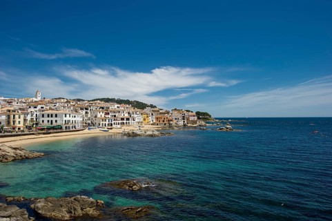 Village with a sandy beach on the sea