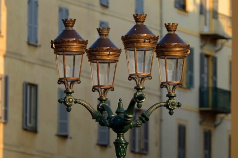 A glorious street lamp in Ajaccio and the facade of a house in the background illuminated by warm morning light. Ajaccio is the capital of the mediterranean island of Corsica