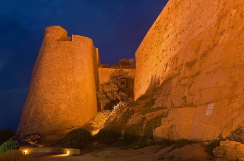 The flood-lit citadel of Calvi at the blue hour after sunset. Calvi is in the department Haute-Corse