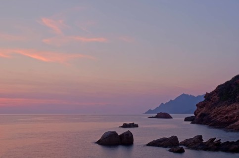 The Gulf of Porto with the surrounding mountains at sunset