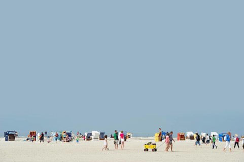 Colourful roofed wicker beach chairs on the beach