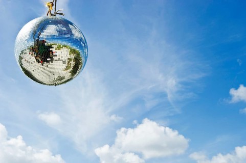 Mirror ball or disco ball against a blue sky