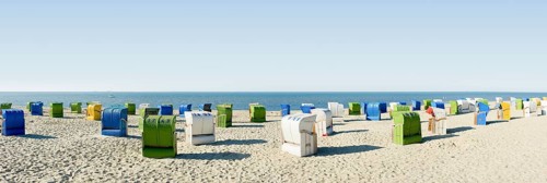 Colourful roofed wicker beach chairs