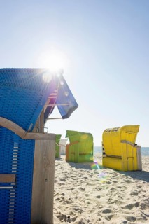 Colourful roofed wicker beach chairs