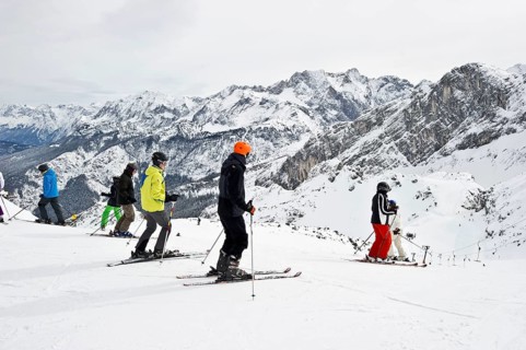 Skiers and mountain landscape at Mt Osterfelderkopf