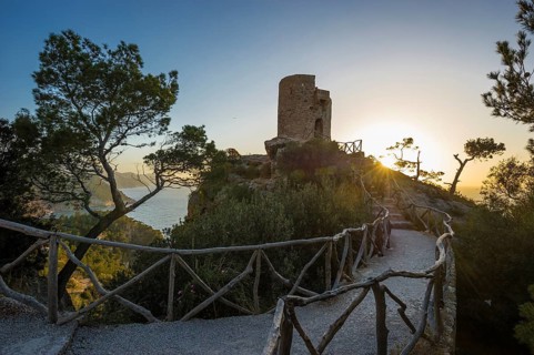 Old watchtower on the coast at sunset
