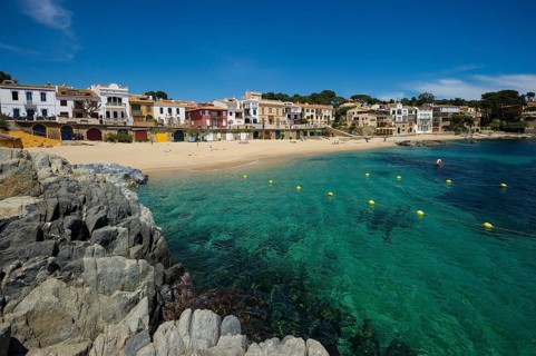 Village with a sandy beach on the sea