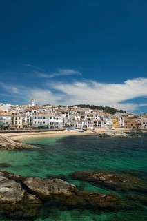 Village with white houses by the sea