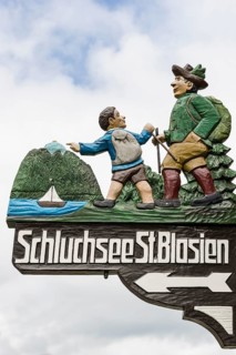 Ornately carved and painted signs