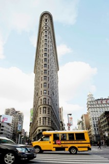 Broadway with a school bus and the Flatiron Building