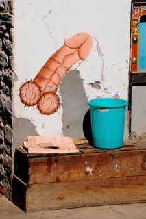 Phallic fertility symbol at the entrance of a house
