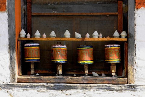 Prayer wheels in the outer wall of a temple