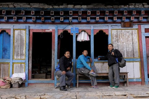 Men outside a shop in the town centre of Mongar