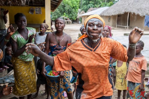 Villagers celebrating a festival with traditional dance and music