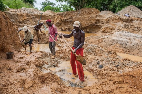 Workers digging at a diamond mine in the jungle