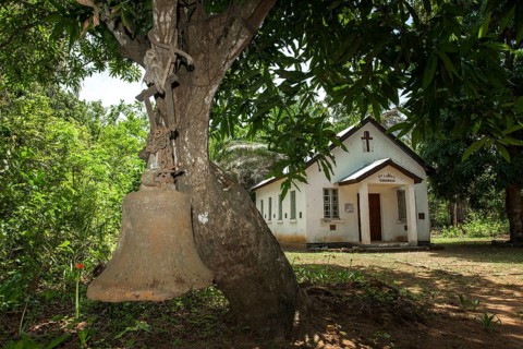 Old bell from the colonial period still used for calling the faithful to the Church of St. Luke