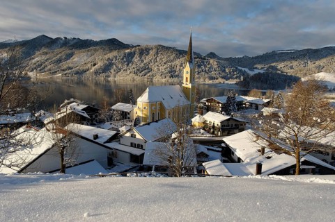 Lake Schliersee with the Church of St. Sixtus in winter