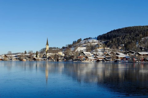 Lake Schliersee with the Church of St. Sixtus in winter