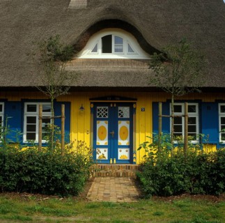 Colourful house with thatched roof
