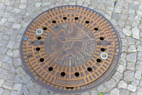 Berlin landmarks depicted on a manhole cover