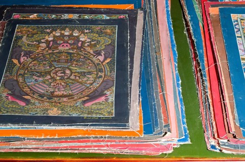 Pile of small Thangkas for sale in one of the art schools near Boudnath Stupa