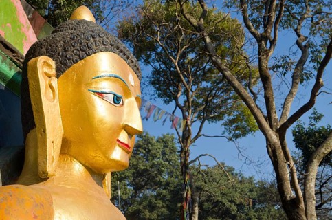 Head of a Buddha sculpture at the entrance of Swayambhunath Stupa