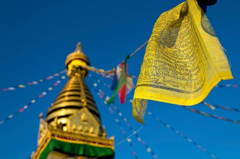 Yellow Buddhist prayer flag with Swayambhunath Stupa