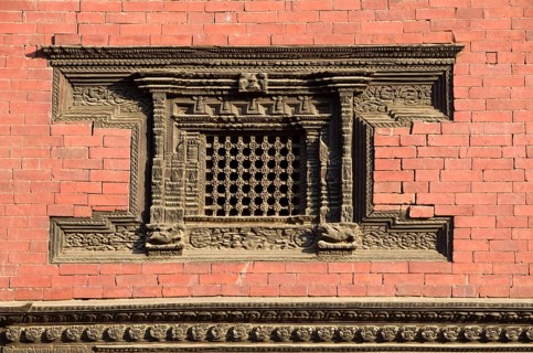Beautifully carved wooden window of a temple