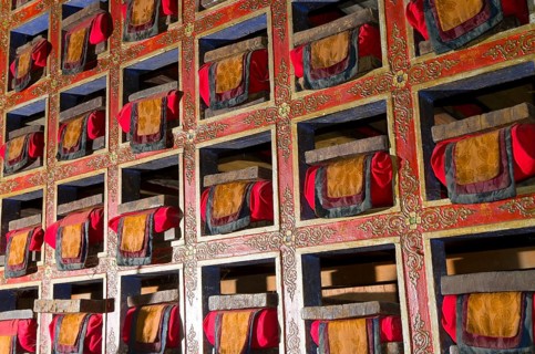 Colorful shelf with tibetean prayerbooks