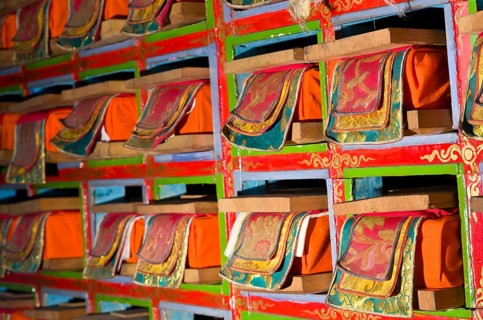 Colorful shelf with tibetean prayerbooks