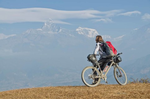 Cyclist leaning on his bike