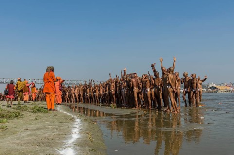Group of new sadhus standing in the river Ganges