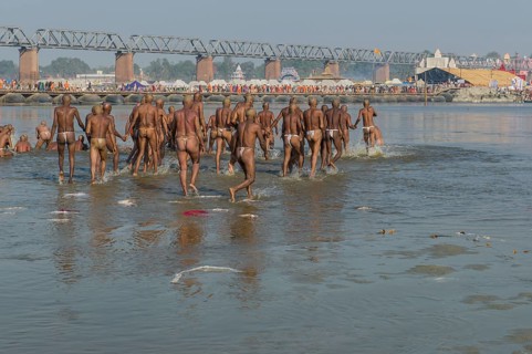 Taking a purifying bath in the river Ganges as part of the initiation of new sadhus
