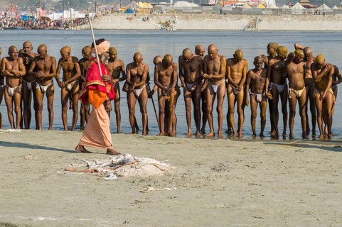 Group of men standing in the river Ganges