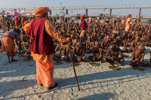 Taking their first meal in their new lives as part of the initiation of new sadhus at the Sangam