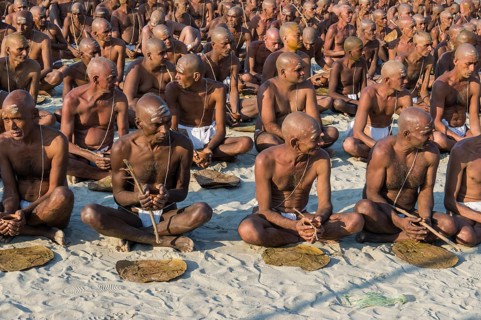 Taking their first meal in their new lives as part of the initiation of new sadhus