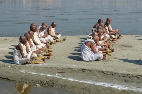 Group of new Jain nuns sitting at the banks of the river Ganges during their initiation