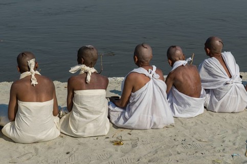 Group of new Jain nuns sitting at the banks of the river Ganges during their initiation