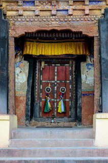The old wooden entrance door of Matho Gompa